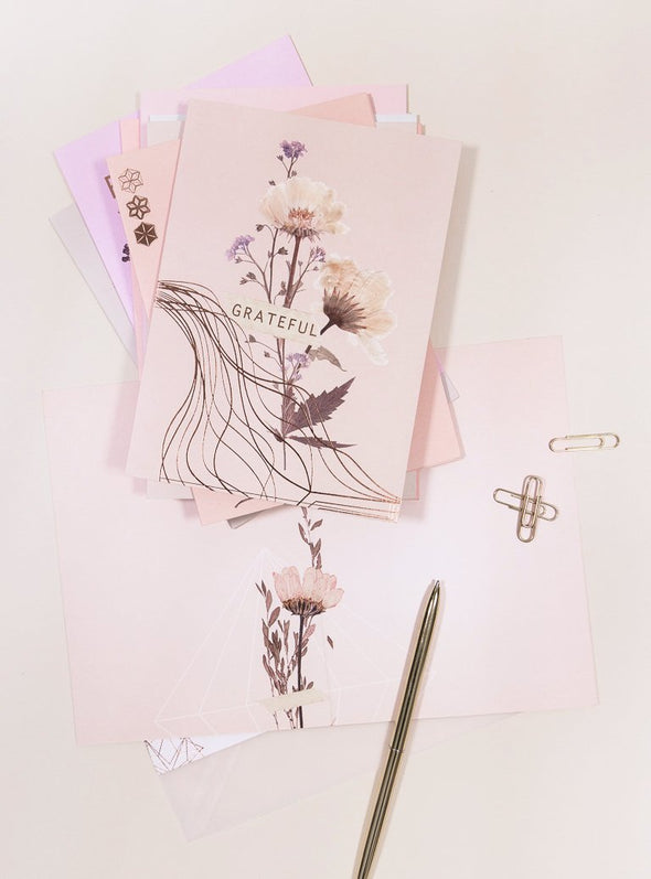 greeting cards with pen on table
