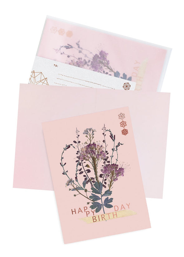 bundle blooms birthday card on table