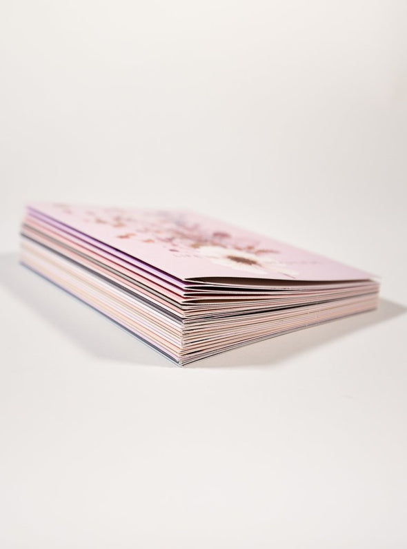 stack of pink greeting cards