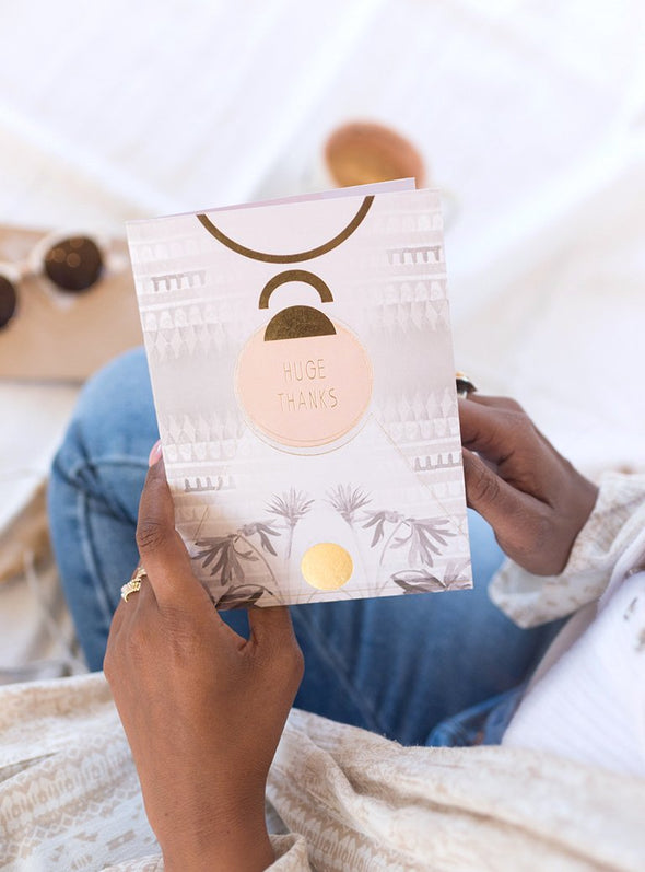 woman holding greeting card