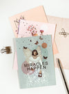 greeting cards with pen on table
